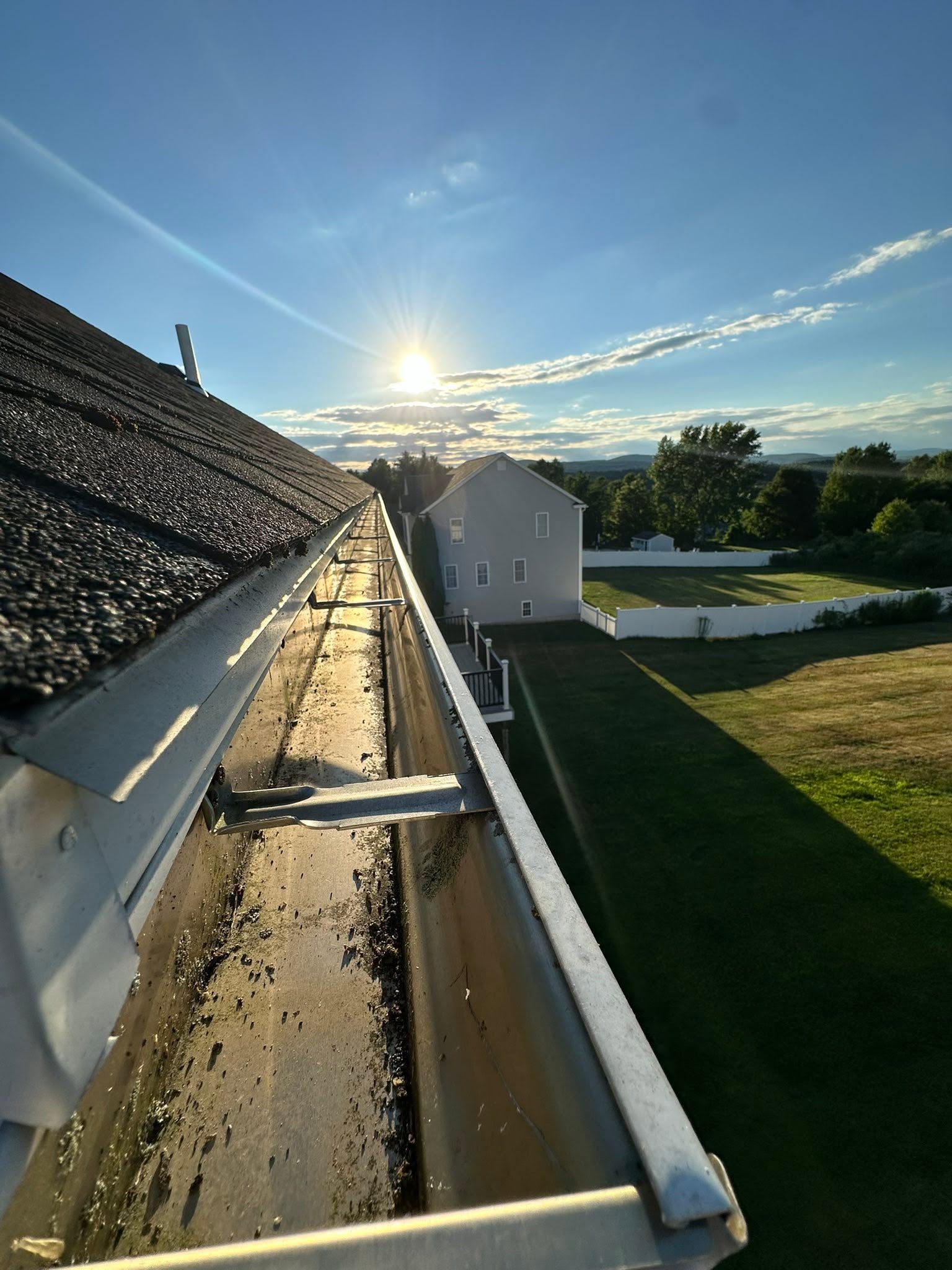Gutter along a roof edge