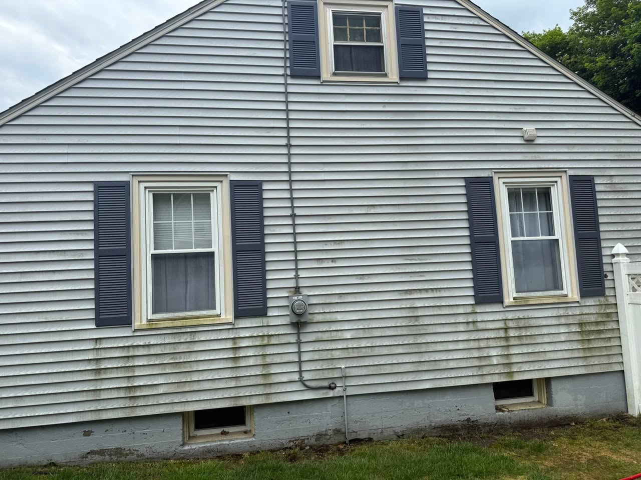 Exterior siding with visible buildup